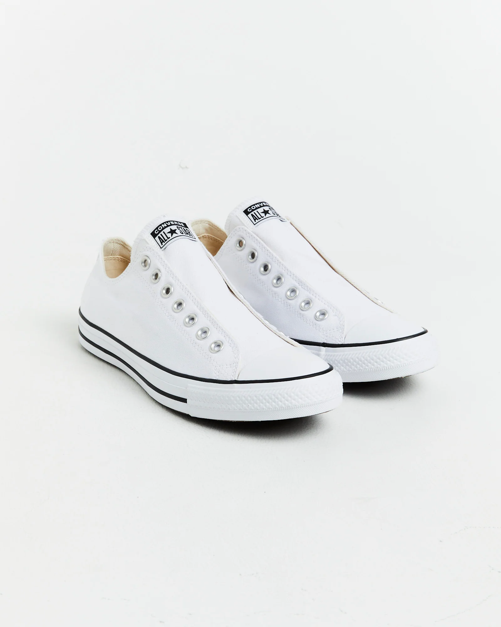 Chuck Taylor All Star Slip On Sneakers In White/Black - Image 2
