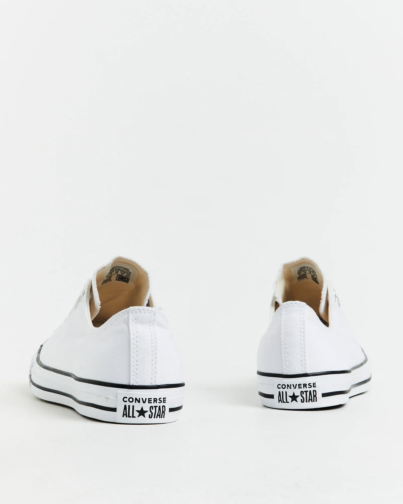Chuck Taylor All Star Slip On Sneakers In White/Black - Image 6